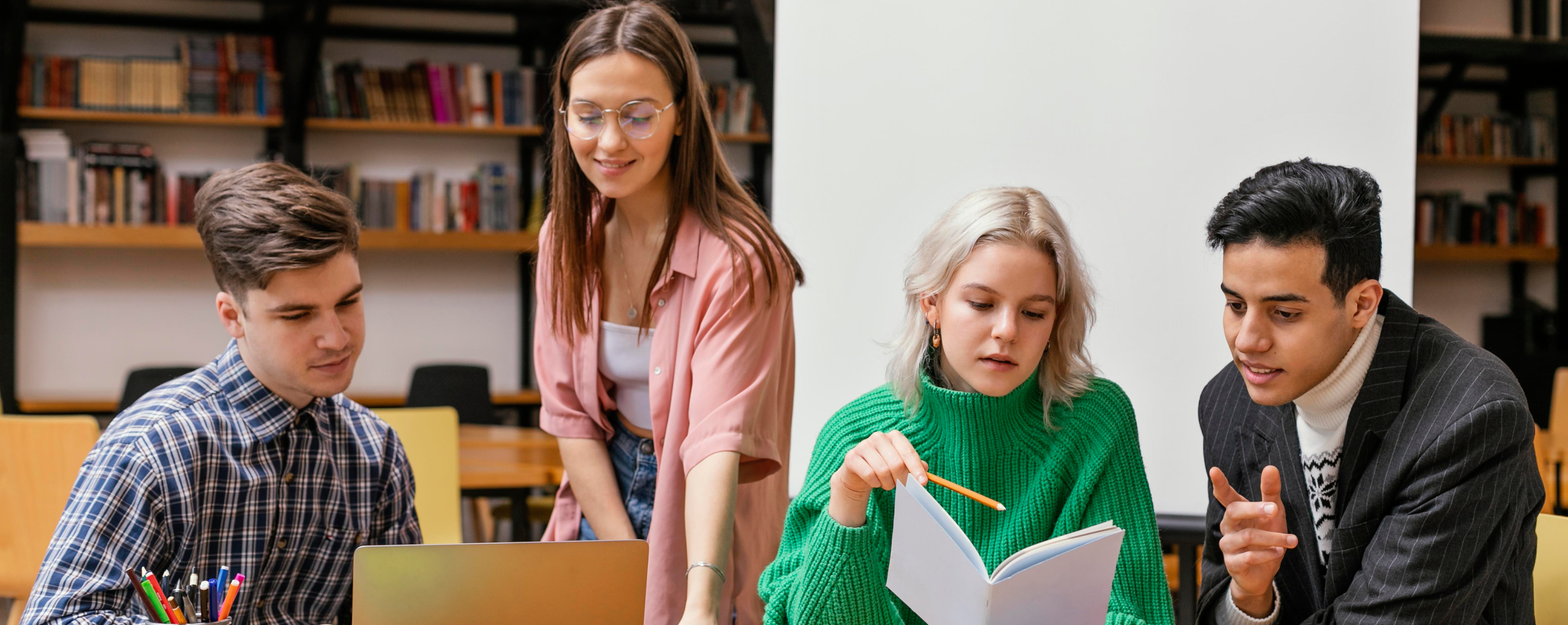 Students collaborating in a school library, the day-to-day a school's assurance records protect